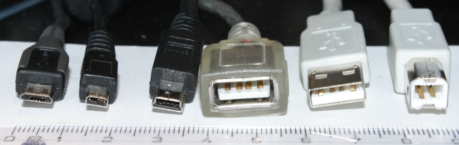 Rangée de connecteurs USB : plugs micro-B, mini-B, socle A retourné montrant ses broches, plugs A et B