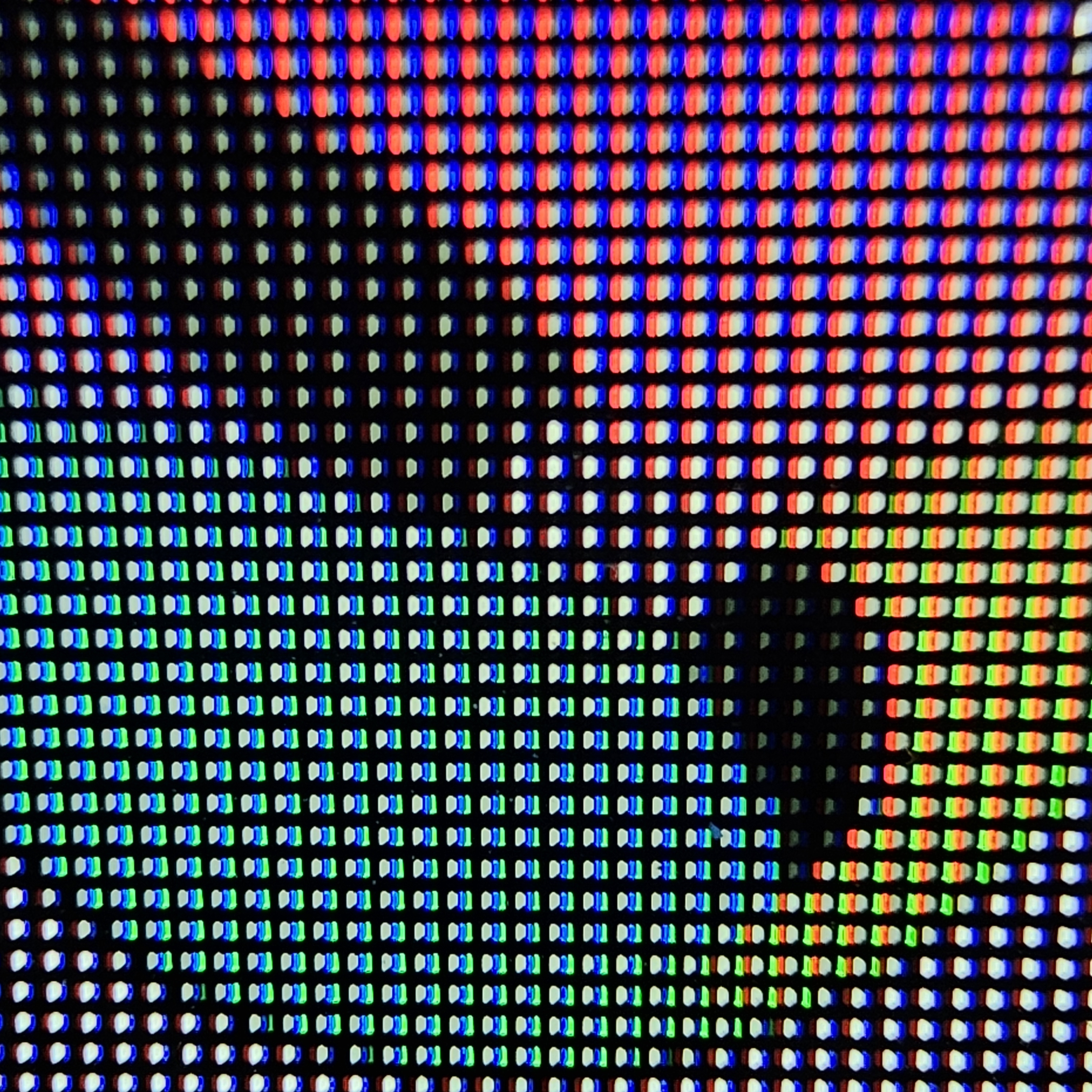Vue macro des sous-pixels rouge, vert et bleu d'un panneau OLED
